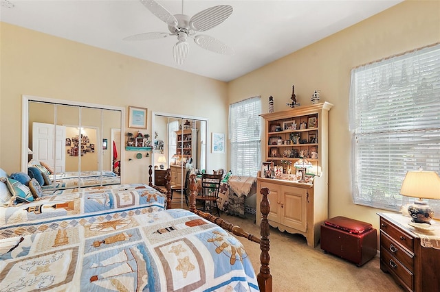 bedroom featuring light carpet and ceiling fan