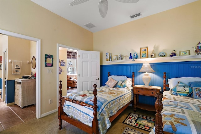 bedroom featuring dark colored carpet and ceiling fan