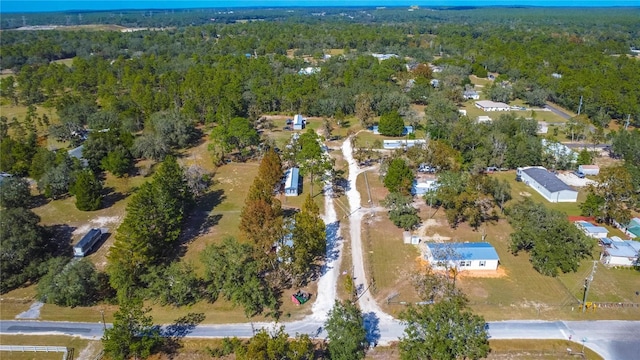 drone / aerial view featuring a forest view