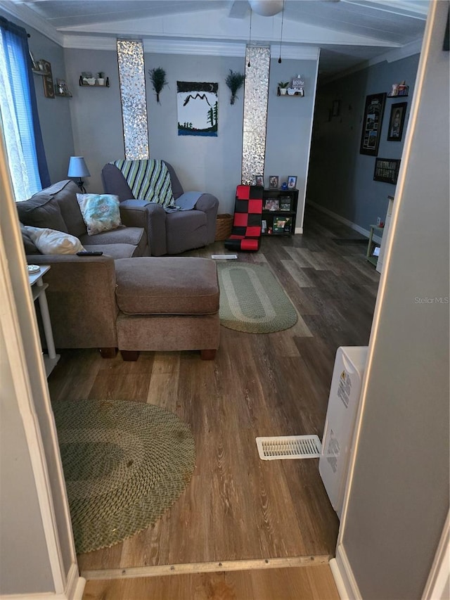 interior space featuring ornamental molding and wood finished floors