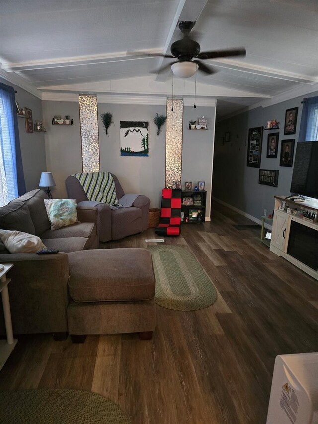 living room featuring dark wood-style floors, ornamental molding, beamed ceiling, and a ceiling fan