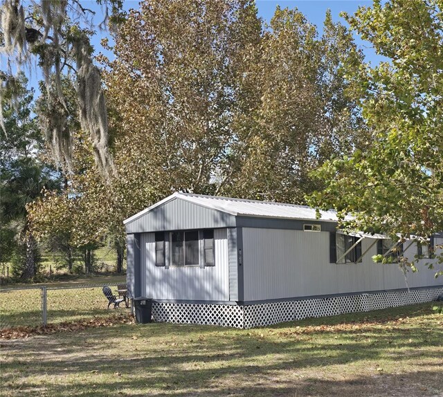 view of outbuilding featuring fence