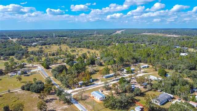 aerial view featuring a wooded view