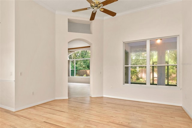 unfurnished room with ornamental molding, light hardwood / wood-style flooring, and ceiling fan