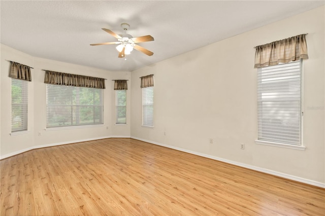 unfurnished room featuring ceiling fan, a textured ceiling, and light hardwood / wood-style flooring