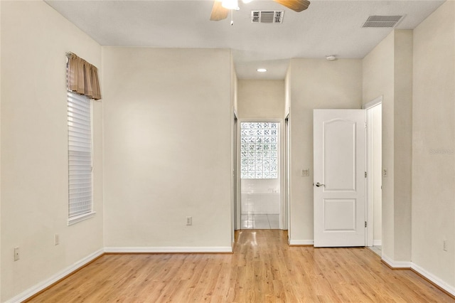 unfurnished room with light hardwood / wood-style floors and ceiling fan