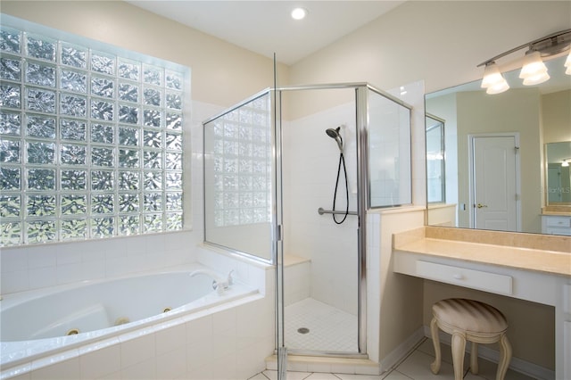 bathroom featuring vanity, independent shower and bath, and tile patterned floors