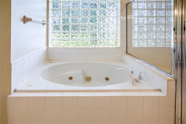 bathroom with tiled bath