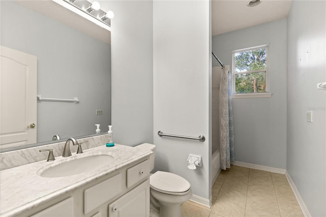 full bathroom featuring toilet, vanity, tile patterned floors, and shower / bath combo with shower curtain