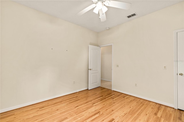 empty room with light wood-type flooring and ceiling fan