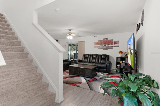 living room with ceiling fan and hardwood / wood-style floors