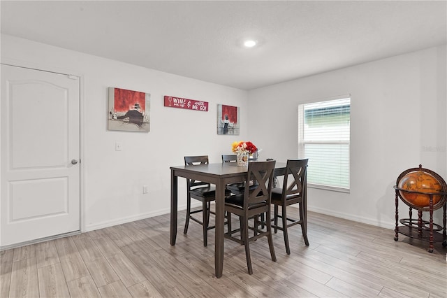 dining space featuring light hardwood / wood-style floors