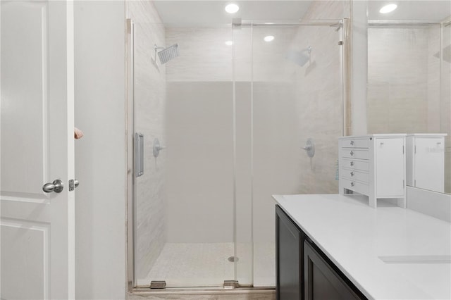 bathroom featuring vanity and walk in shower