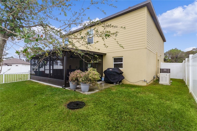 back of house featuring a yard