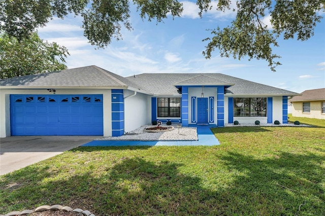 single story home with a front yard and a garage