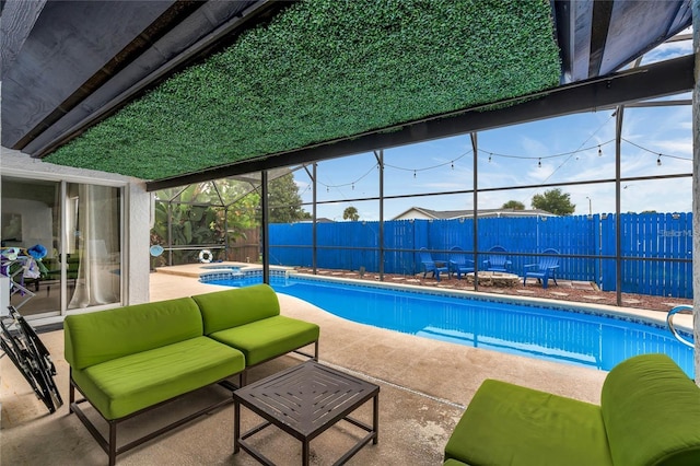 view of pool with an in ground hot tub, a lanai, and a patio