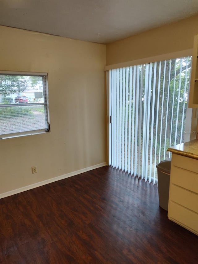 spare room featuring dark hardwood / wood-style floors