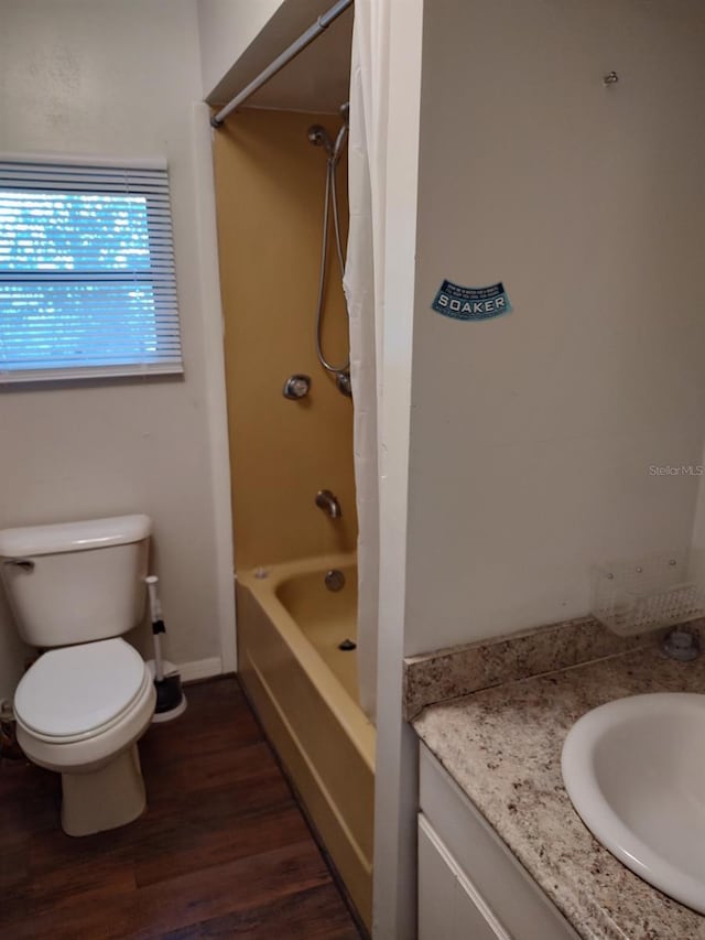 full bathroom with wood-type flooring, vanity, toilet, and shower / bathtub combination