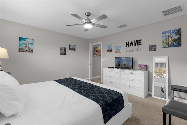 bedroom featuring ceiling fan, visible vents, baseboards, and light colored carpet