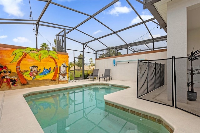 view of pool featuring a patio area and a lanai