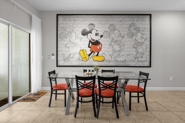 dining room with baseboards and light tile patterned floors