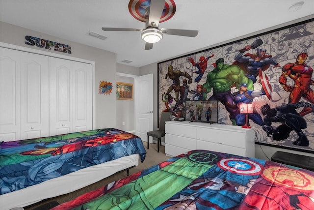 carpeted bedroom with ceiling fan, visible vents, and a closet