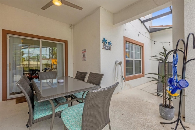 view of patio featuring ceiling fan and outdoor dining space