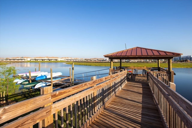 dock area featuring a gazebo and a water view