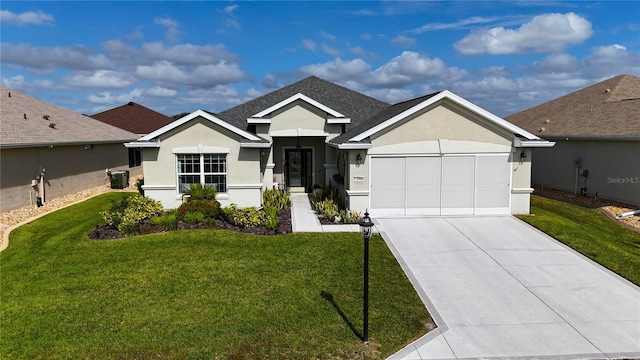 ranch-style house featuring a garage and a front lawn