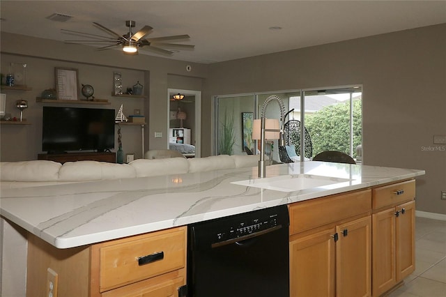 kitchen with dishwasher, sink, ceiling fan, light tile patterned floors, and a kitchen island