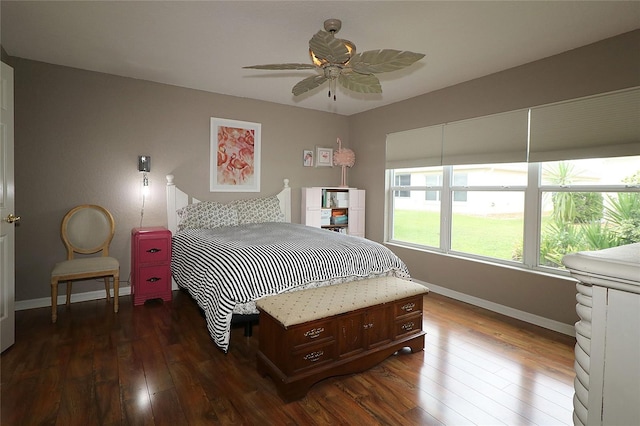 bedroom with ceiling fan and dark hardwood / wood-style flooring