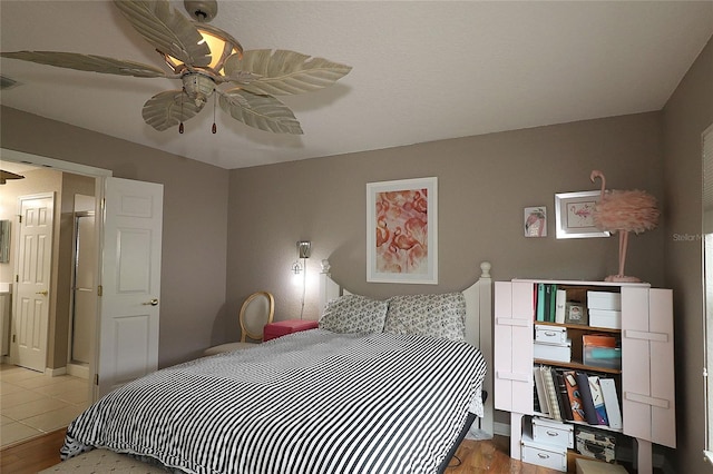 bedroom with light hardwood / wood-style flooring and ceiling fan