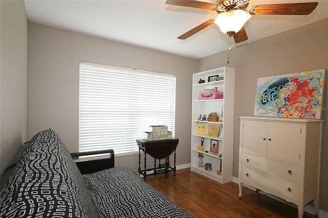 bedroom featuring ceiling fan and dark hardwood / wood-style floors