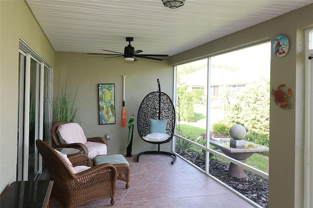 sunroom / solarium with ceiling fan