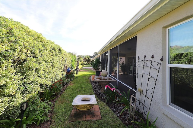 view of yard with a sunroom