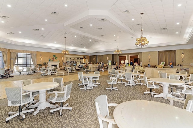 interior space featuring vaulted ceiling, carpet floors, and a chandelier