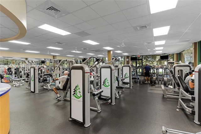 exercise room featuring a drop ceiling