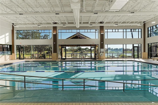 view of swimming pool with a water view