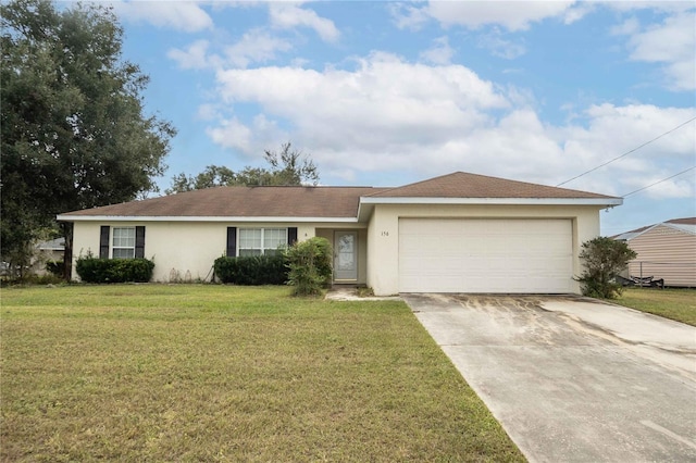 ranch-style house featuring a garage and a front lawn