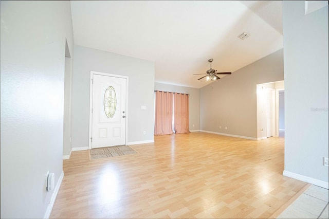 entrance foyer featuring light wood-type flooring, vaulted ceiling, and ceiling fan