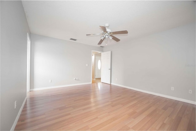 empty room with light hardwood / wood-style floors and ceiling fan