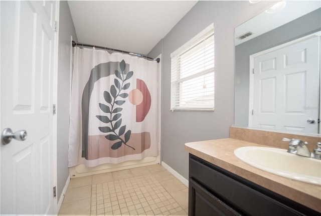 bathroom with vanity, tile patterned flooring, and shower / bathtub combination with curtain