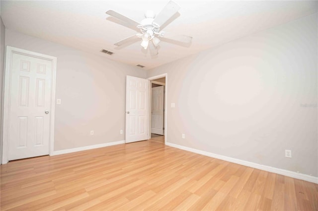 unfurnished room featuring ceiling fan and light hardwood / wood-style flooring