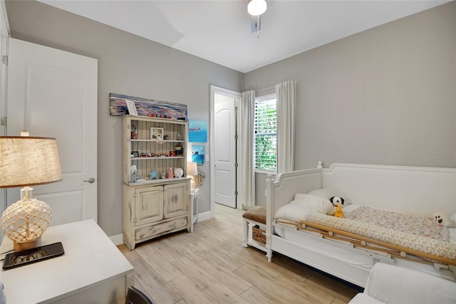 bedroom featuring ceiling fan and light hardwood / wood-style floors