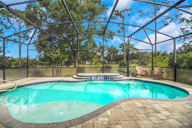 view of pool with a lanai, a patio area, and a water view