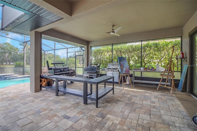 sunroom / solarium with ceiling fan and a swimming pool