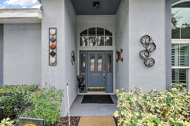 1720 Park Forest Blvd, Mount Dora, FL 32757 - property entrance featuring stucco siding