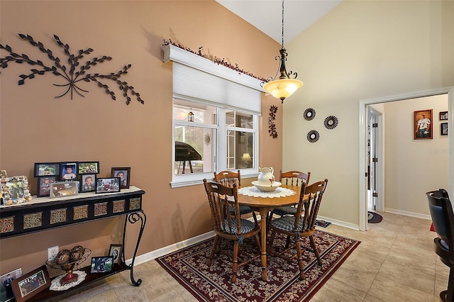 1720 Park Forest Blvd, Mount Dora, FL 32757 - dining space featuring baseboards and high vaulted ceiling