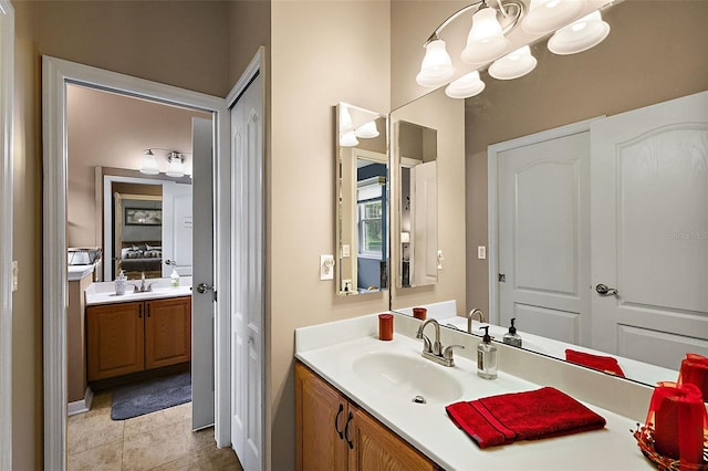 bathroom with tile patterned flooring and vanity