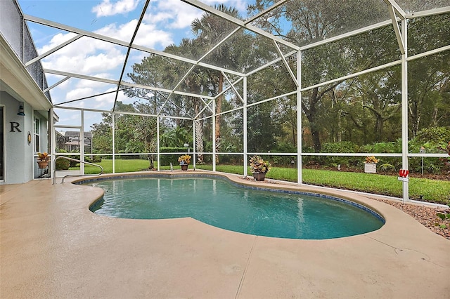 view of swimming pool with glass enclosure, a lawn, and a patio